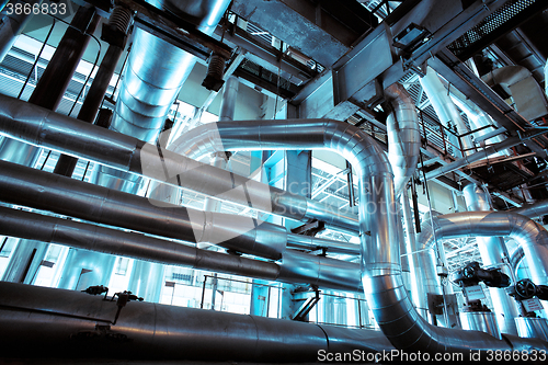 Image of Equipment, cables and piping as found inside of a modern industr