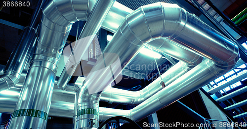 Image of Equipment, cables and piping as found inside of a modern industr