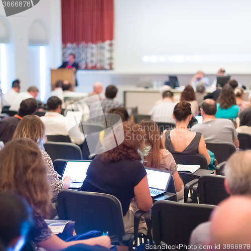 Image of Speaker at Business Conference and Presentation.