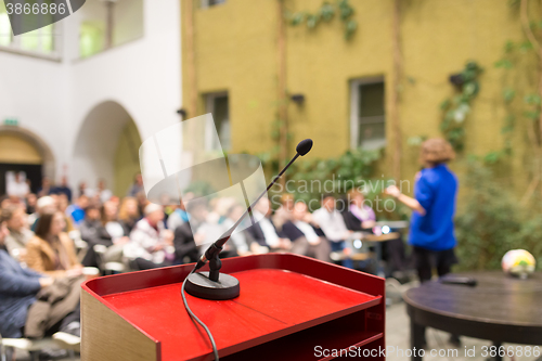 Image of Female speaker at Business Conference.