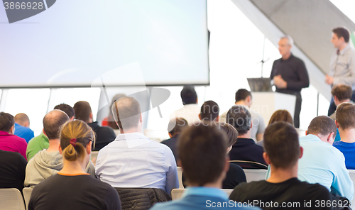 Image of Male speeker having talk at public event.