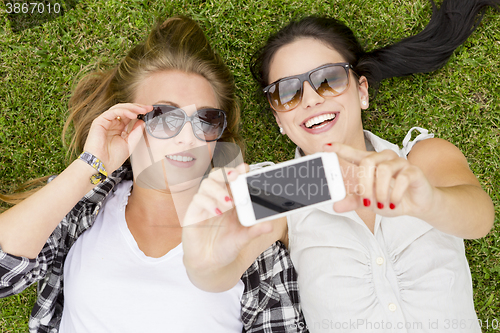 Image of Best friends taking selfies