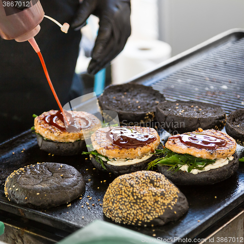 Image of Beef burgers ready to serve on food stall.