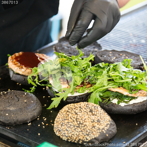 Image of Beef burgers ready to serve on food stall.