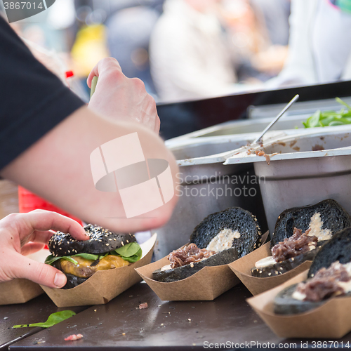 Image of Beef burgers ready to serve on food stall.