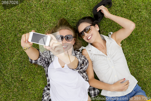 Image of Best friends taking selfies