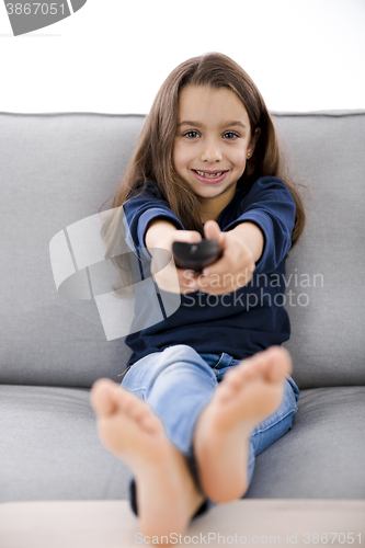 Image of Girl holding a TV remote