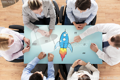 Image of close up of business team sitting at table