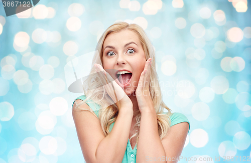 Image of surprised smiling young woman or teenage girl