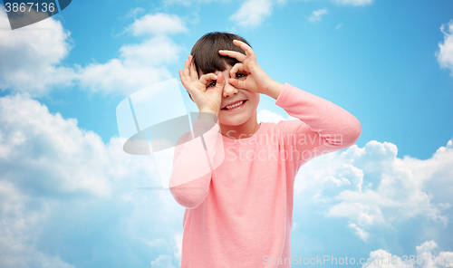 Image of happy little girl making faces and having fun