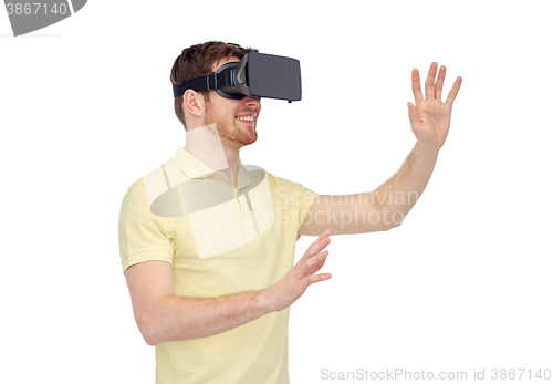 Image of happy man in virtual reality headset or 3d glasses