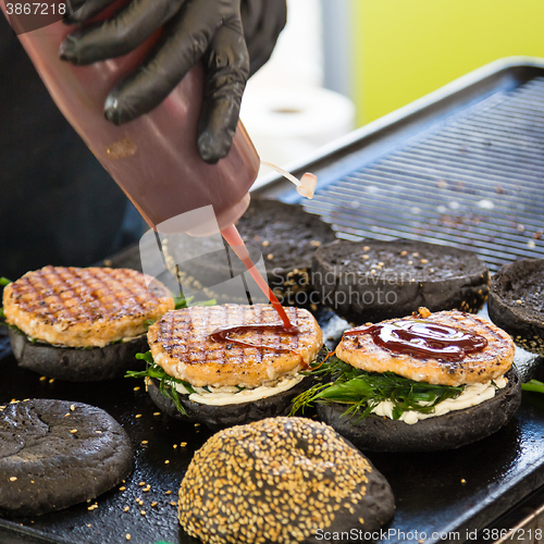 Image of Beef burgers ready to serve on food stall.