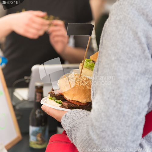 Image of Beef burgers being served on street food stall