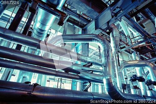 Image of Equipment, cables and piping as found inside of a modern industr