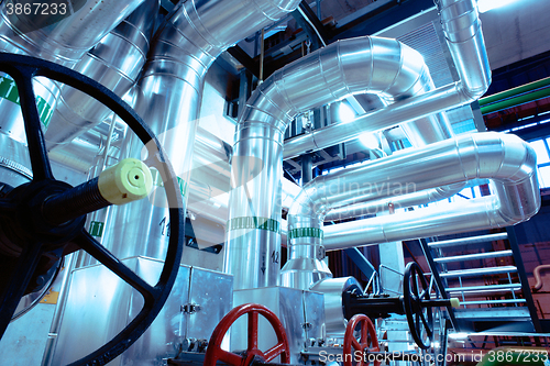 Image of Equipment, cables and piping as found inside of a modern industr