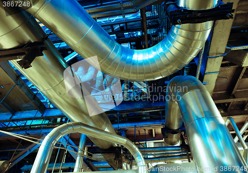 Image of Equipment, cables and piping as found inside of a modern industr