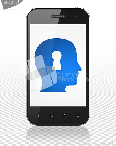 Image of Advertising concept: Smartphone with Head With Keyhole on display