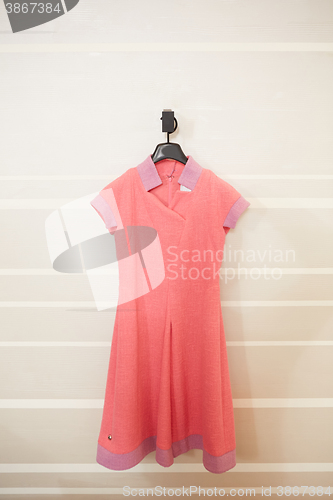 Image of one red dress on hanger 