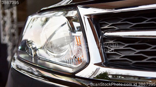 Image of Car headlights. Exterior detail.