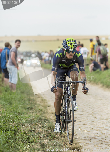 Image of Anacona Gomez Riding on a Cobblestone Road - Tour de France 2015