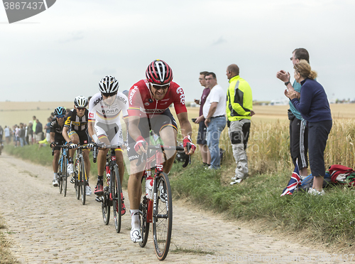 Image of Group of Cyclists on a Cobblestone Road - Tour de France 2015