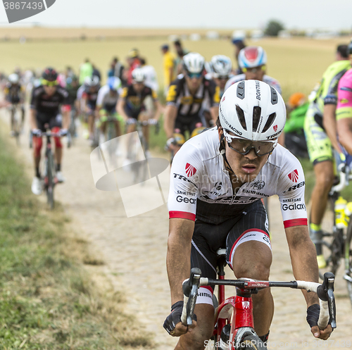 Image of Arredondo Moreno Riding on a Cobblestone Road - Tour de France 2