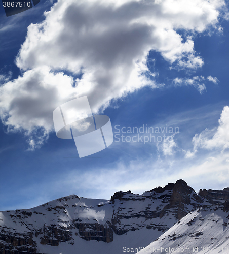 Image of Snowy mountains in sun evening
