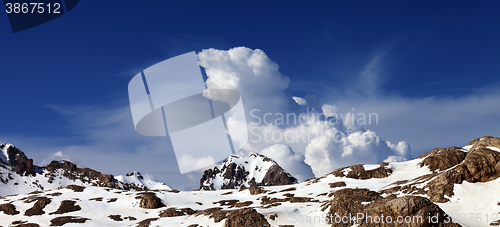 Image of Panoramic view on snowy rocks at nice day
