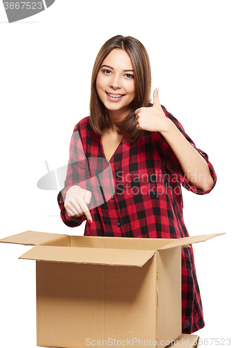 Image of Young woman with cardboard boxes