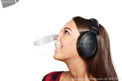 Image of Female listening enjoying music in headphones