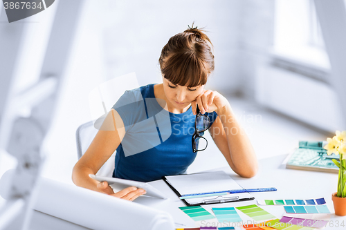 Image of woman working with color samples for selection