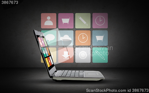 Image of laptop with application icons menu on screen