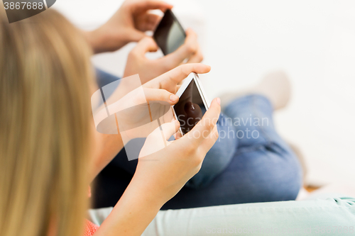 Image of close up of woman texting on smartphones