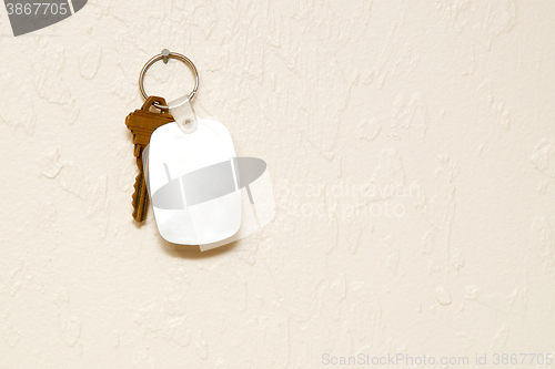 Image of Keyring with key and fob on wall