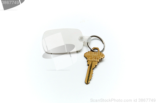 Image of Keyring with  house key and fob over white