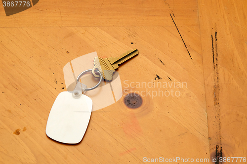 Image of Keyring with key and fob on wood table