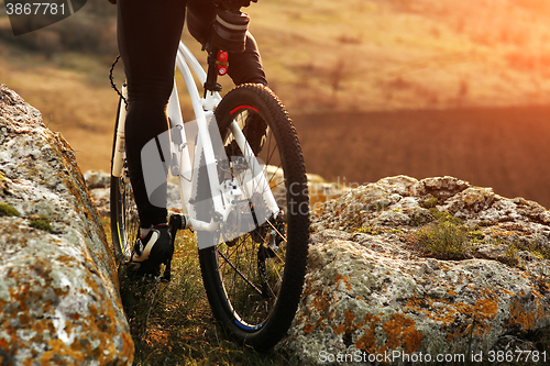 Image of Man cyclist riding the bicycle