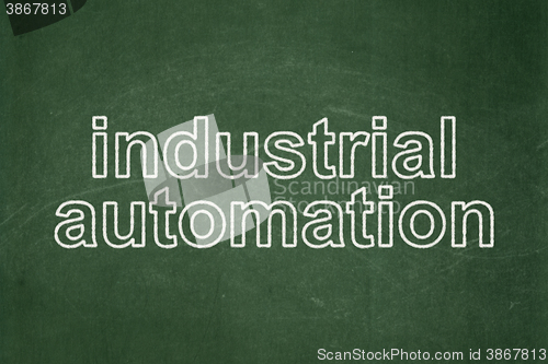 Image of Manufacuring concept: Industrial Automation on chalkboard background