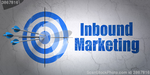 Image of Advertising concept: target and Inbound Marketing on wall background