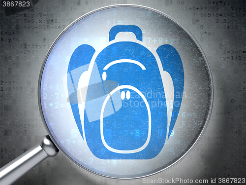 Image of Learning concept: Backpack with optical glass on digital background