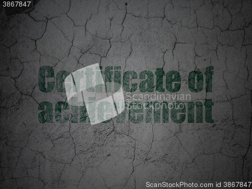 Image of Studying concept: Certificate of Achievement on grunge wall background