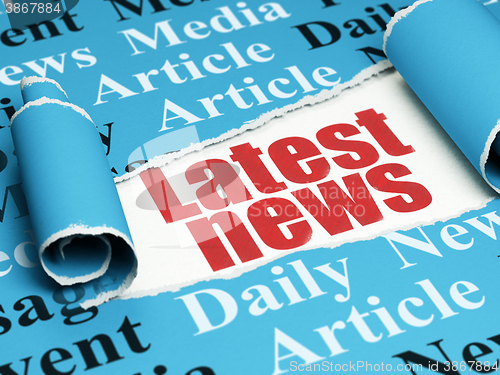 Image of News concept: red text Latest News under the piece of  torn paper