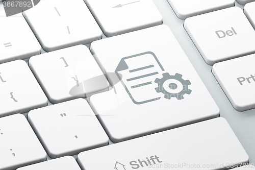 Image of Database concept: Gear on computer keyboard background