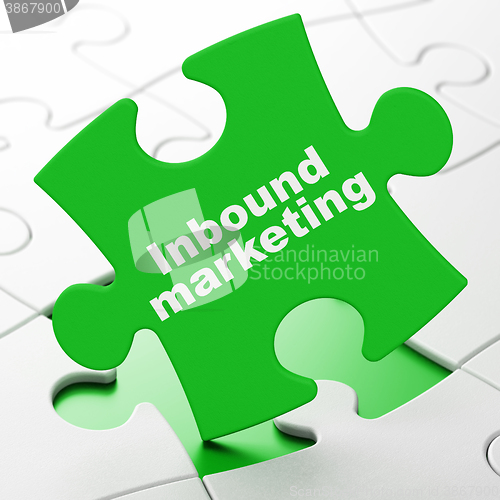 Image of Advertising concept: Inbound Marketing on puzzle background