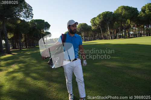 Image of golf player walking