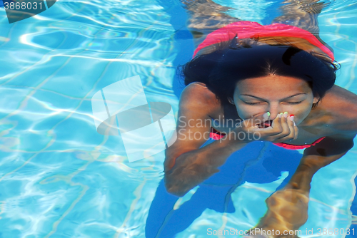 Image of Teenage girl in the swimming pool