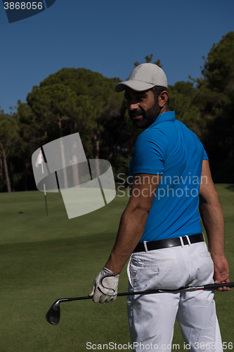 Image of golf player portrait from back