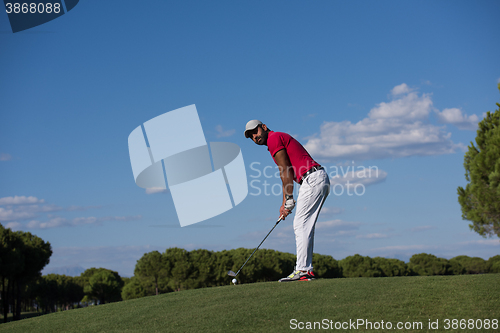 Image of golf player hitting long shot