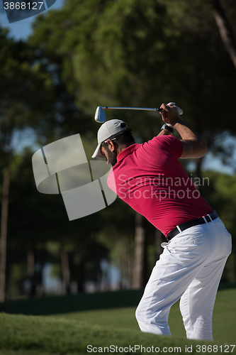 Image of golfer hitting a sand bunker shot