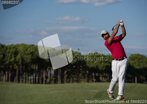 Image of golf player hitting long shot